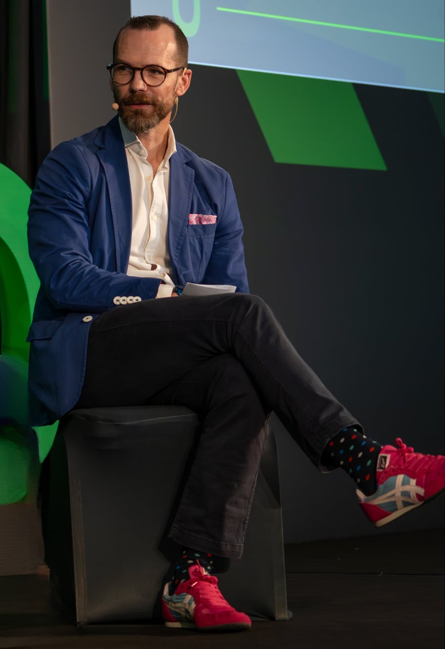 Brendan Ellis moderating a panel discussion
